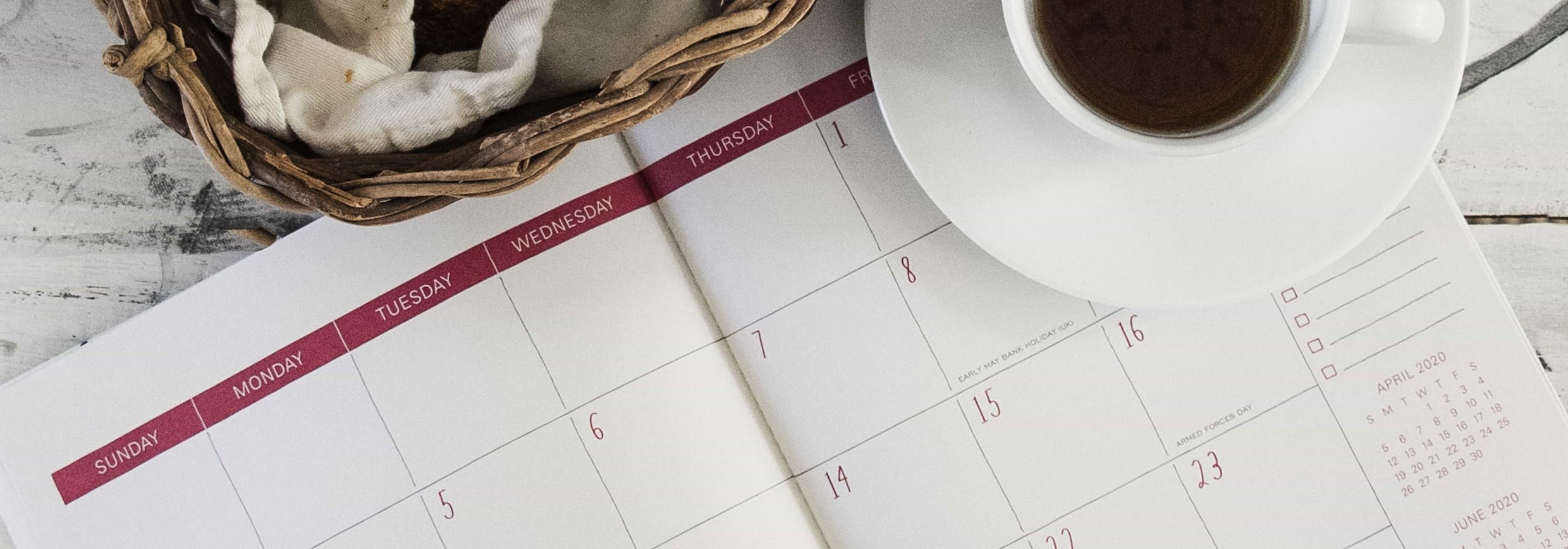 cup of coffee and open calendar representing maximising productivity